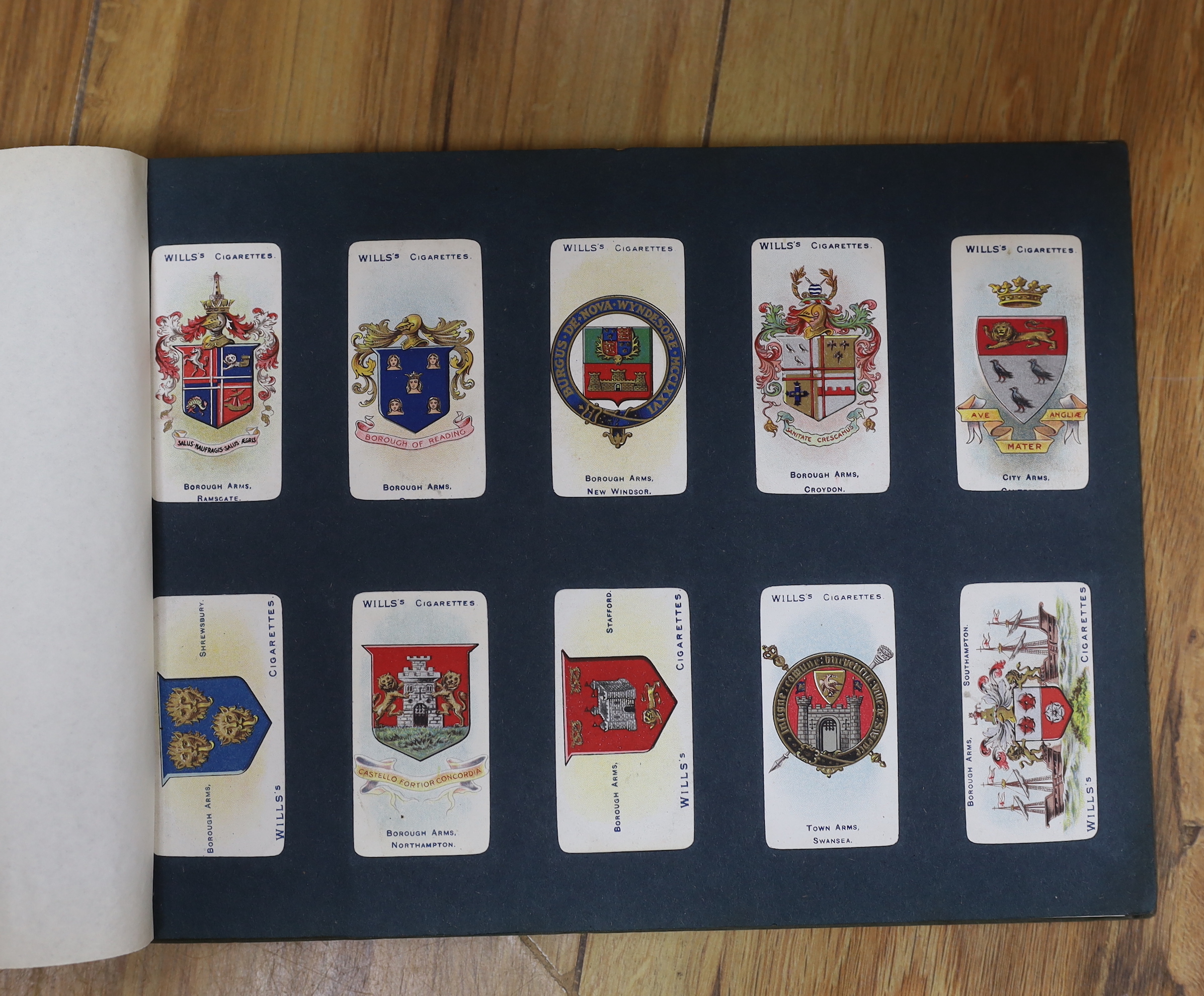 A collection of cigarette cards in albums